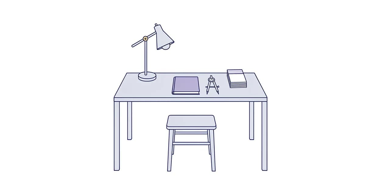 A plain writing desk and stool with a desk lamp, a closed notebook, drawing compasses and a short stack of blank index cards.