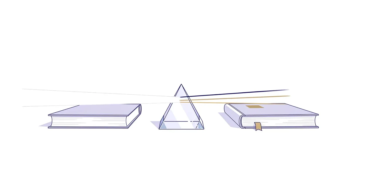 a glass prism between two books, splitting one beam of light into coloured beams