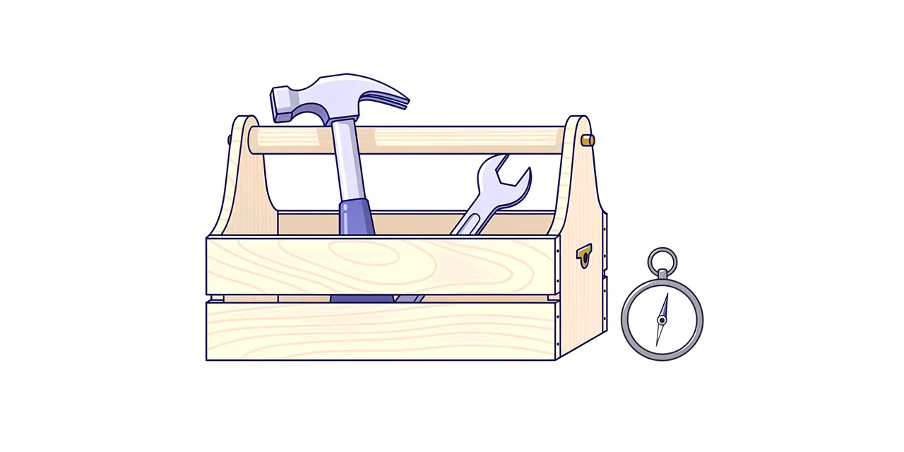 an open wooden toolbox holding a hammer and a spanner, with a plain pocket compass beside it
