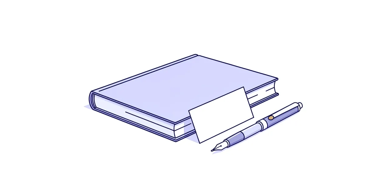 a closed book with a blank card propped against it and a fountain pen alongside